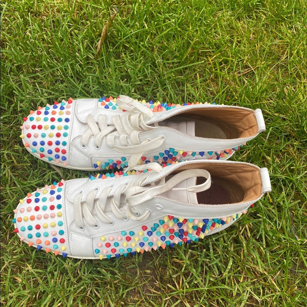 Gently used Christian Louboutin White Multicolor high top.